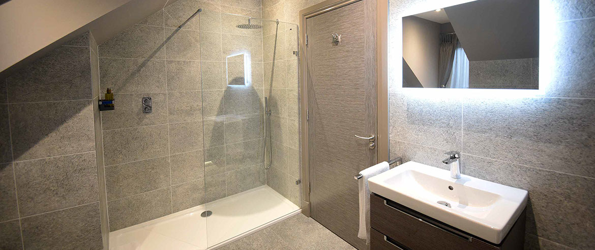 Taransay House guest rooms contain spacious luxury bathrooms with powerful shower bath and electric mirror