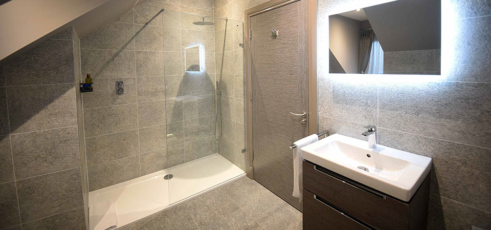 Taransay House guest rooms contain spacious luxury bathrooms with powerful shower bath and electric mirror